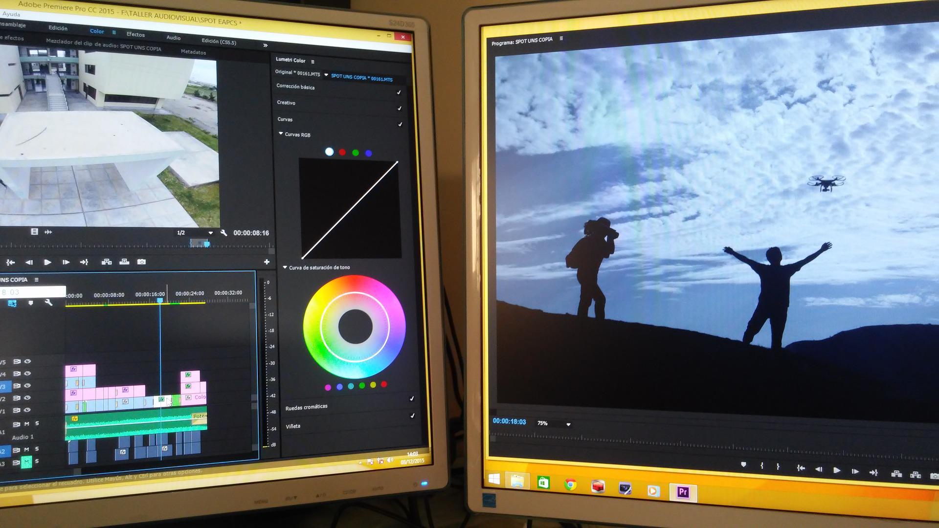 Dos pantallas de ordenador juntas en las que se muestran un programa de edición de vídeo y en la otra pantalla una toma de un vídeo.